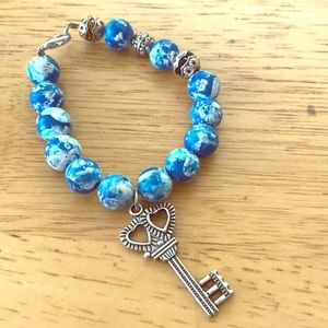 New earth globe bracelet with key
